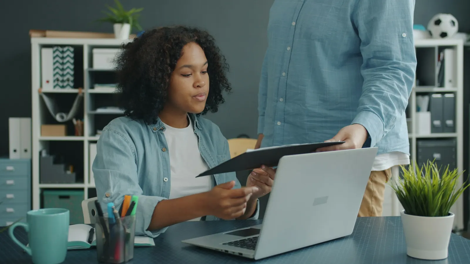Business owner reviewing FFL and merchant account application documents with an advisor