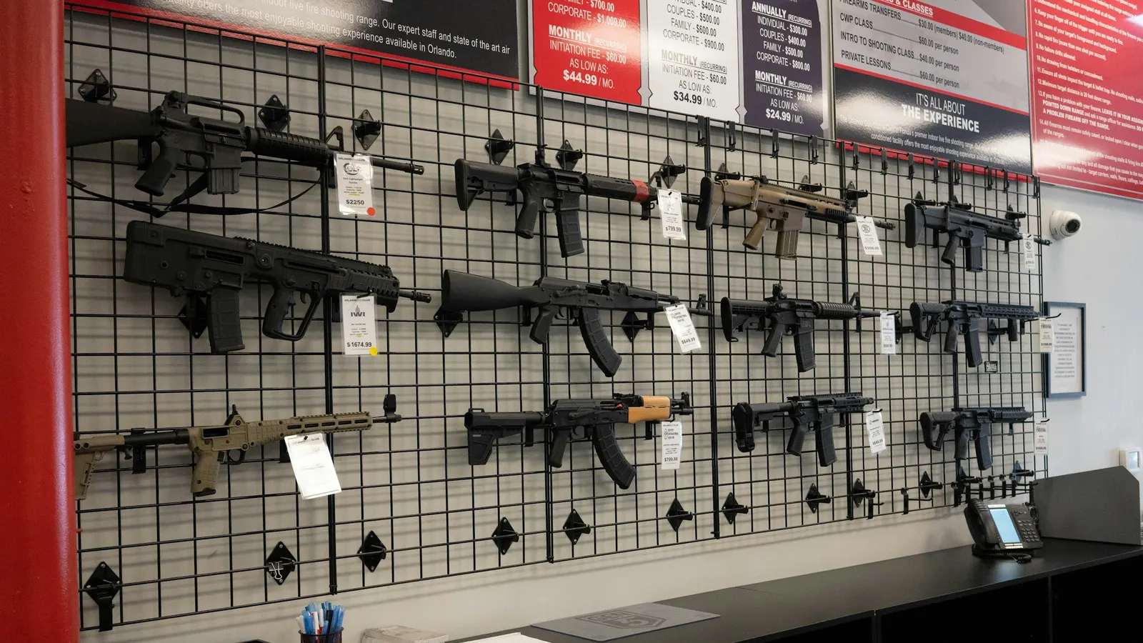 Rifles on the wall of a licensed gun store that accepts credit cards