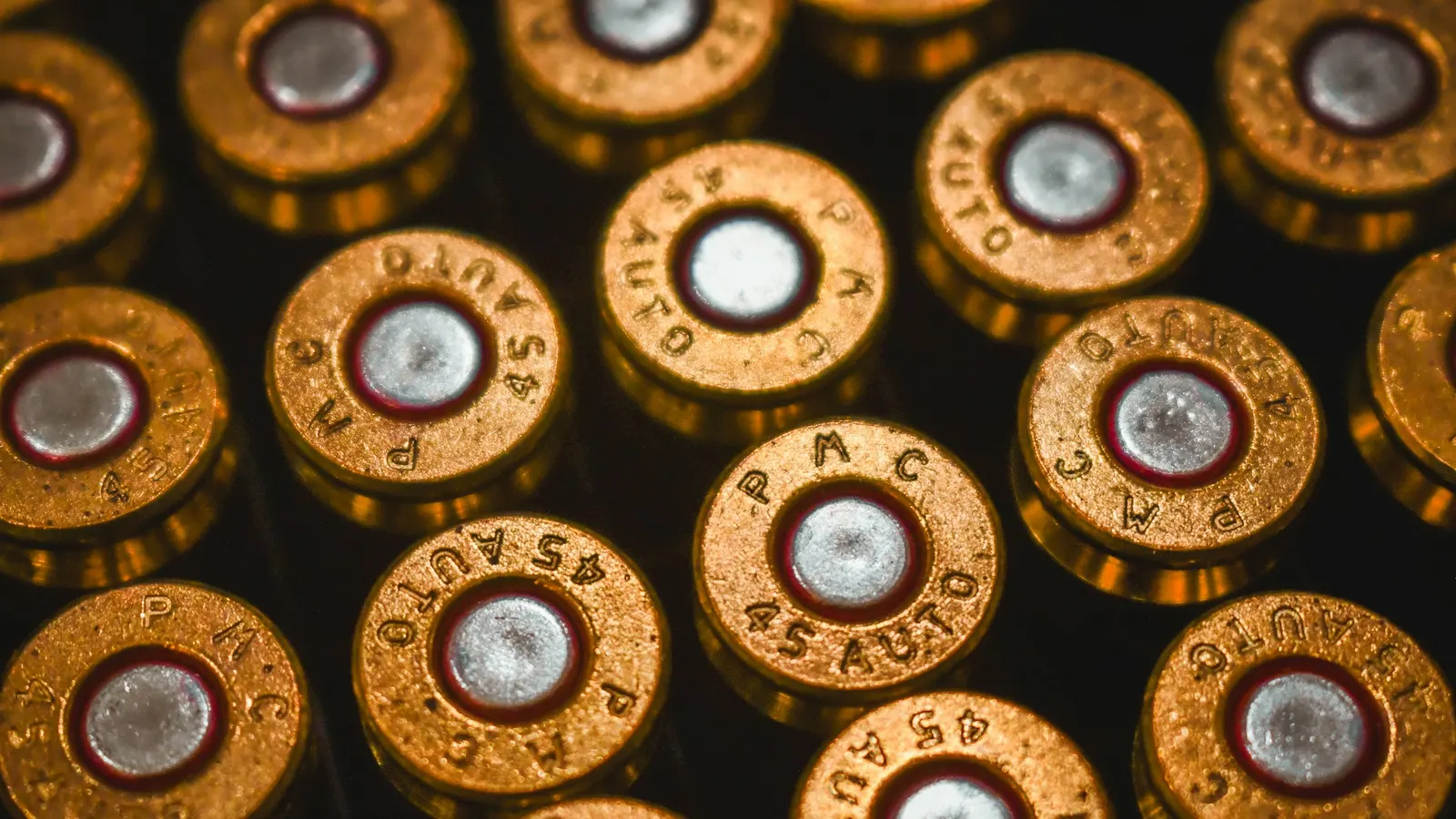 Close-up of .45 ACP ammunition cartridges, a product with its own online sales rules